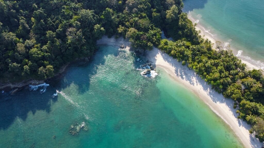 pexels-photo-11181988-11181988 Stunning aerial shot of the lush coast and clear water at Manuel Antonio Beach in Costa Rica.