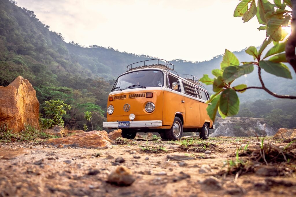pexels-photo-2832251-2832251 A classic orange Volkswagen van parked in a picturesque setting in Alegría, El Salvador.