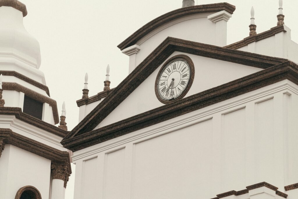 pexels-photo-29446314-29446314 Architectural detail of a classical clock tower in Alajuela, Costa Rica.