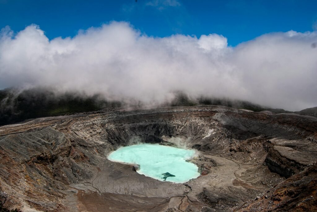pexels-photo-9069745-9069745 A breathtaking aerial view of the Poás Volcano crater in Costa Rica surrounded by mist and steam.