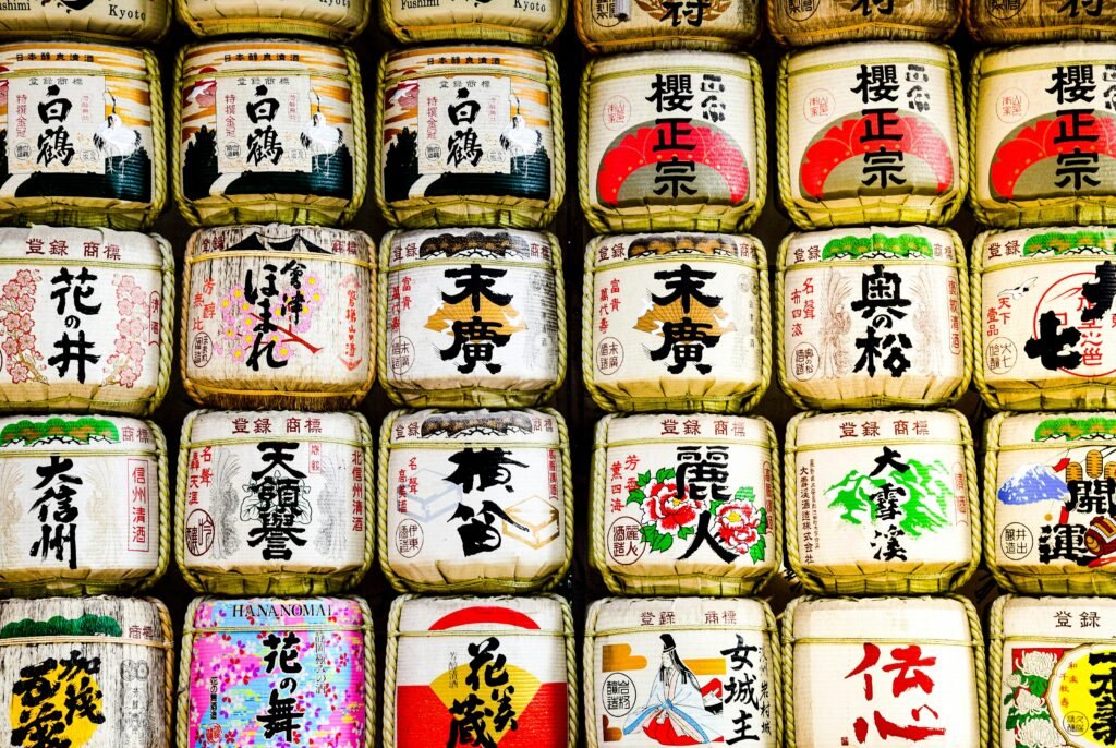 pexels-photo-16412231-16412231 Colorful sake barrels at Tokyo's Meiji Jingu shrine, a traditional Japanese landmark.