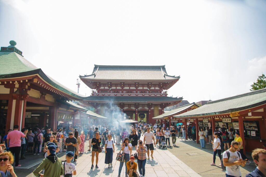 A vibrant crowd at Senso-ji Temple in Tokyo, Japan, capturing the essence of culture and tourism.