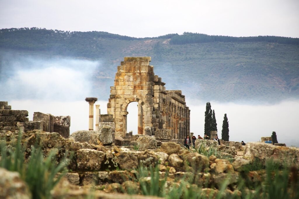 A shot of roman ruins of a temple in Volubilis historic site in Morocco
