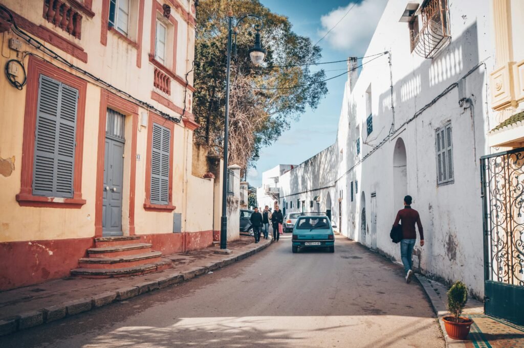 Charming street view of Tangier, Morocco with pedestrians and classic architecture.