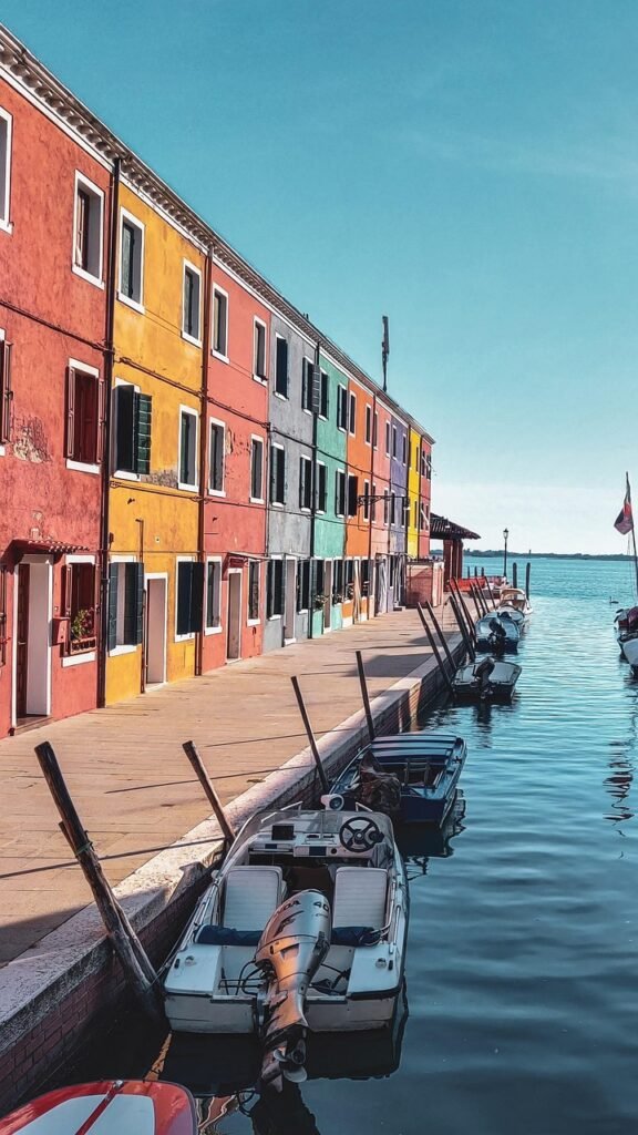 Colorful canals and boats in Burano, Venice, Italy