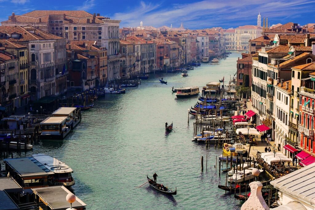 Boats and gondolas navigating the Grand Canal (Canale Grande) in Venice, Italy.
