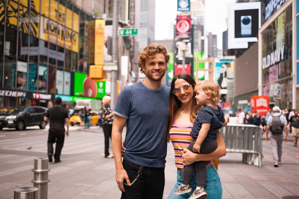 a picture of a family with time square as background