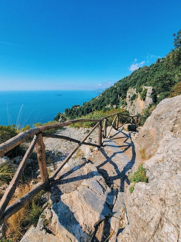 Explore the picturesque walking trail with breathtaking views of the sea from Positano, Italy.