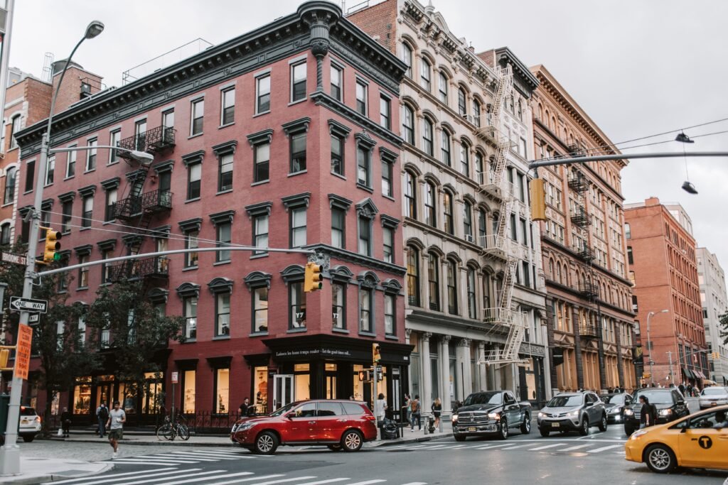 Dynamic street scene in Soho, NYC showcasing classic architecture and urban life.