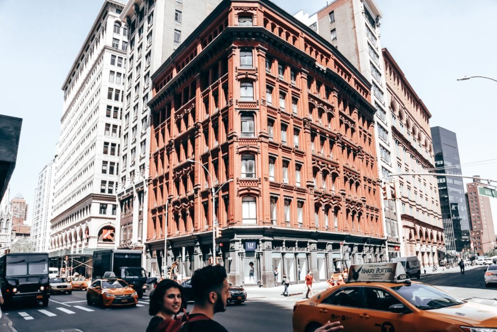 Vibrant street scene in Soho, NYC featuring busy traffic and iconic architecture.
