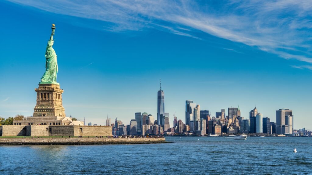 Breathtaking view of the Statue of Liberty with the Manhattan skyline in the background.